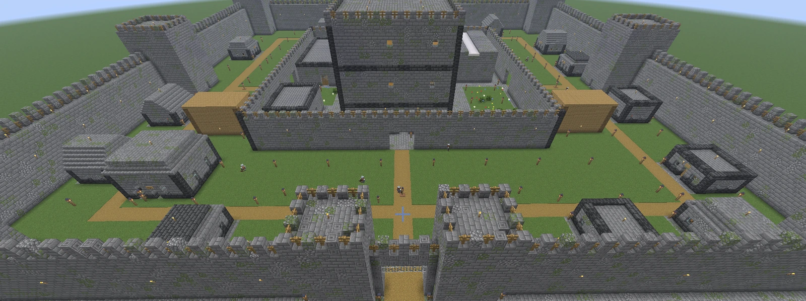 An enormous dwarven castle town: outer curtain walls, an inner keep, and rows of shops connected by paths, populated with dwarves
