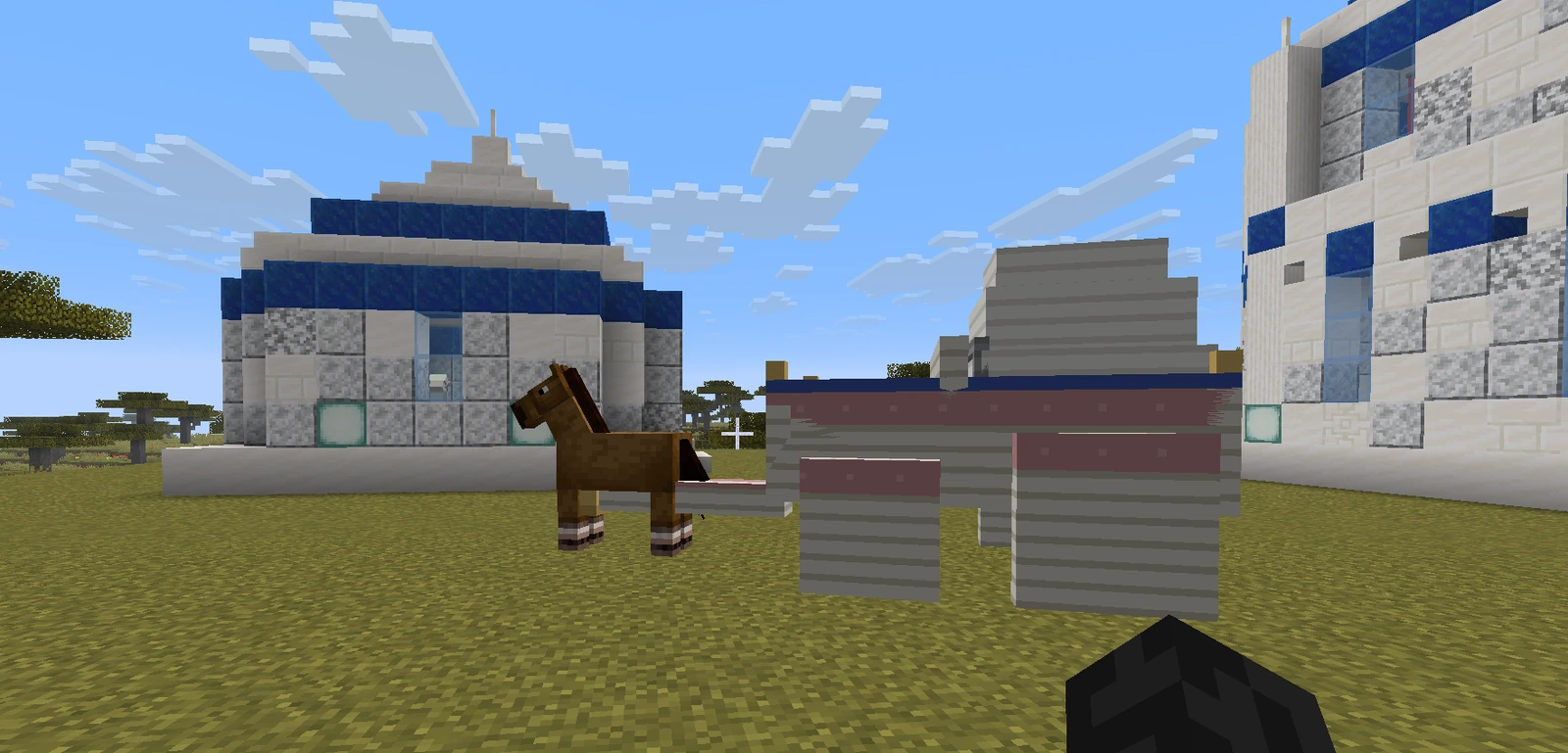A horse-drawn elven covered wagon standing between two quartz buildings in a savanna town