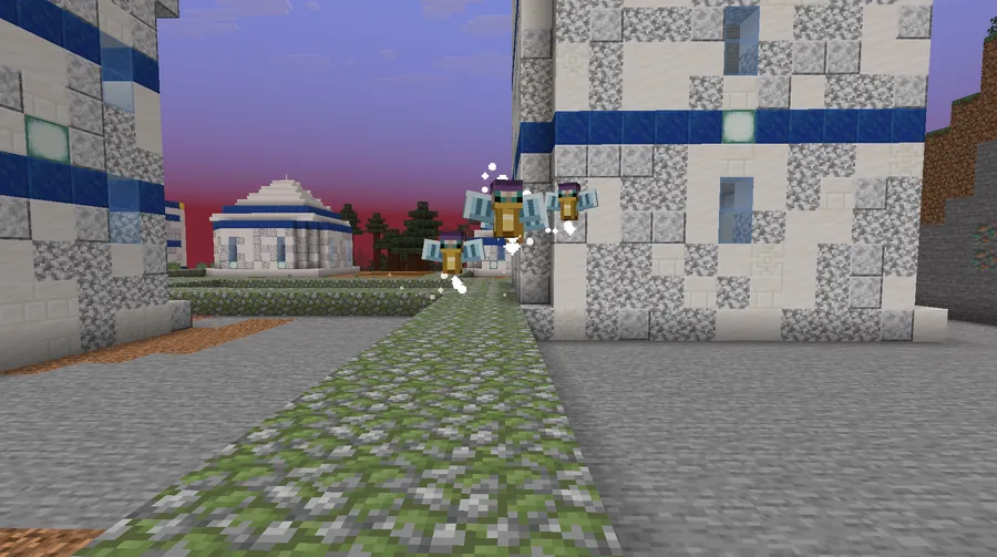 Three small winged faeries hovering in a street of white and blue stone buildings