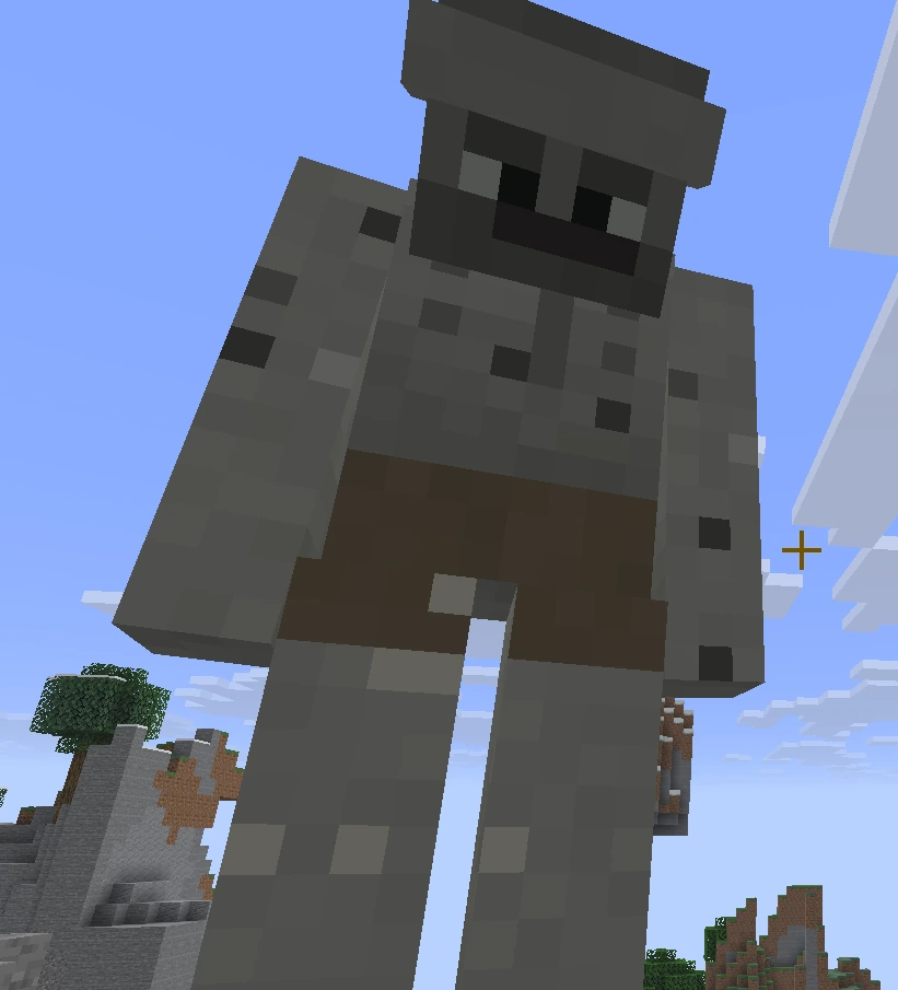 The Stone Giant, a towering mossy-grey figure seen from below against the sky