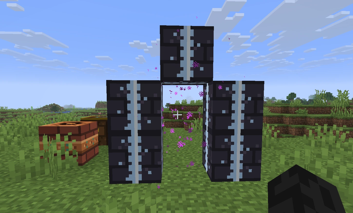 A standing gateway of dark stone with pale veins, purple sparks drifting through the opening, in a grass field